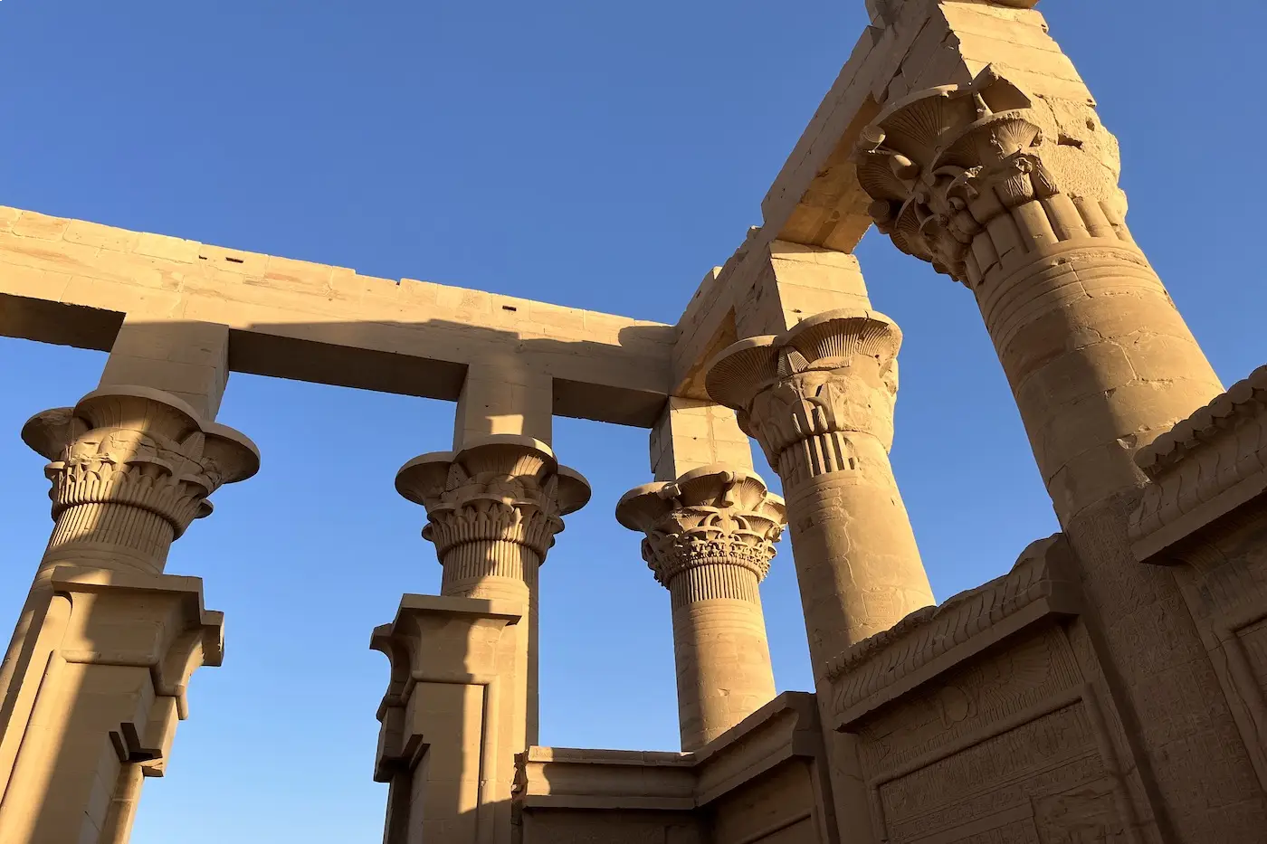 The temple of Philae rising above the water at Aswan on a luxury Egypt travel itinerary
