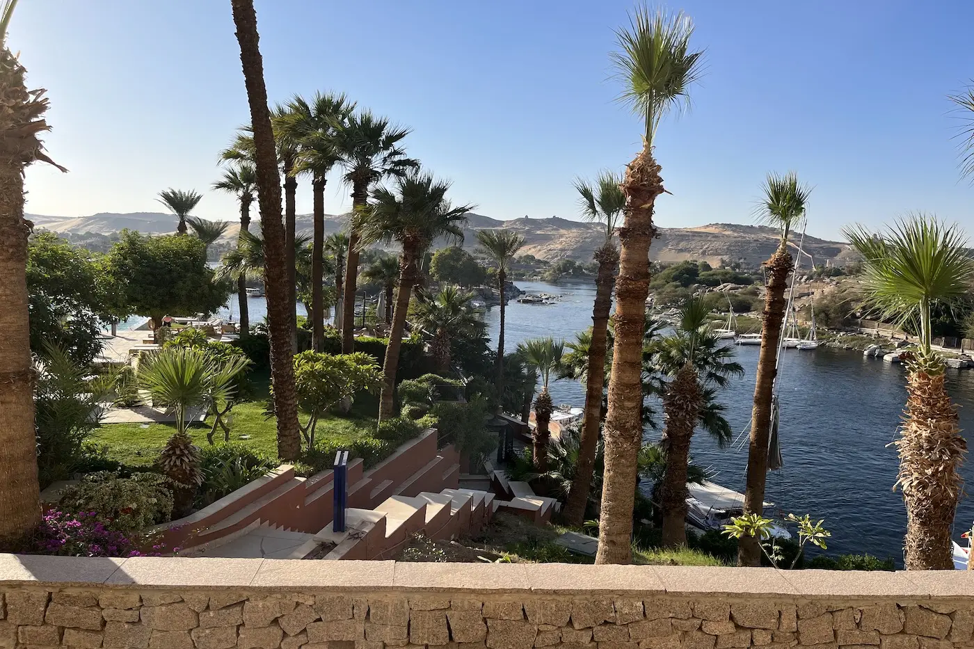 Shaded garden walkway on a Nile island in Aswan, an unhurried afternoon on a luxury Egypt honeymoon or family tour
