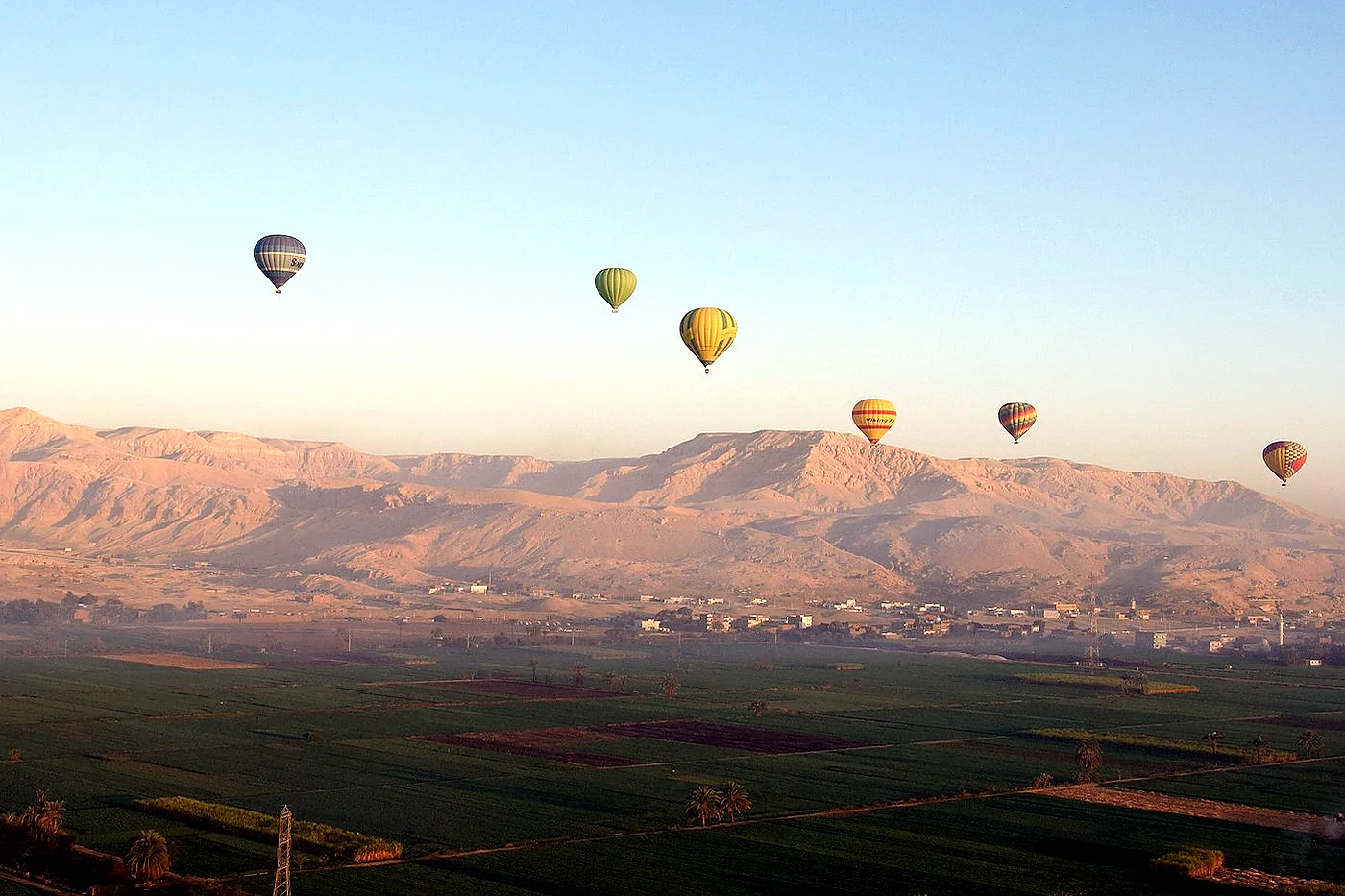 Hot-air balloon flight at sunrise over the Luxor West Bank