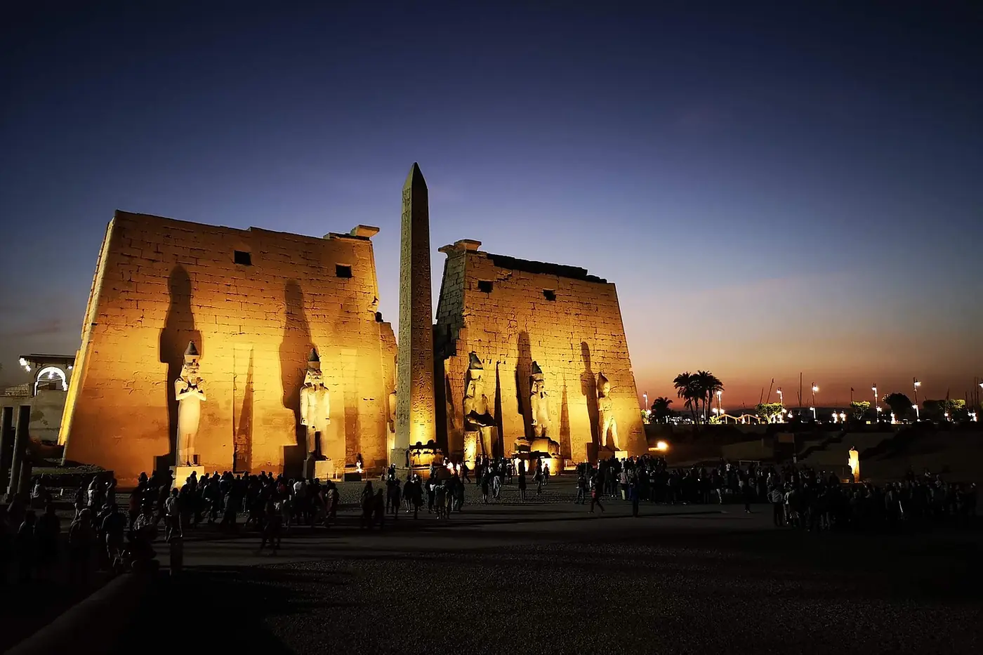 Luxor Temple floodlit after dark on the east bank of the Nile in the centre of Luxor, Egypt