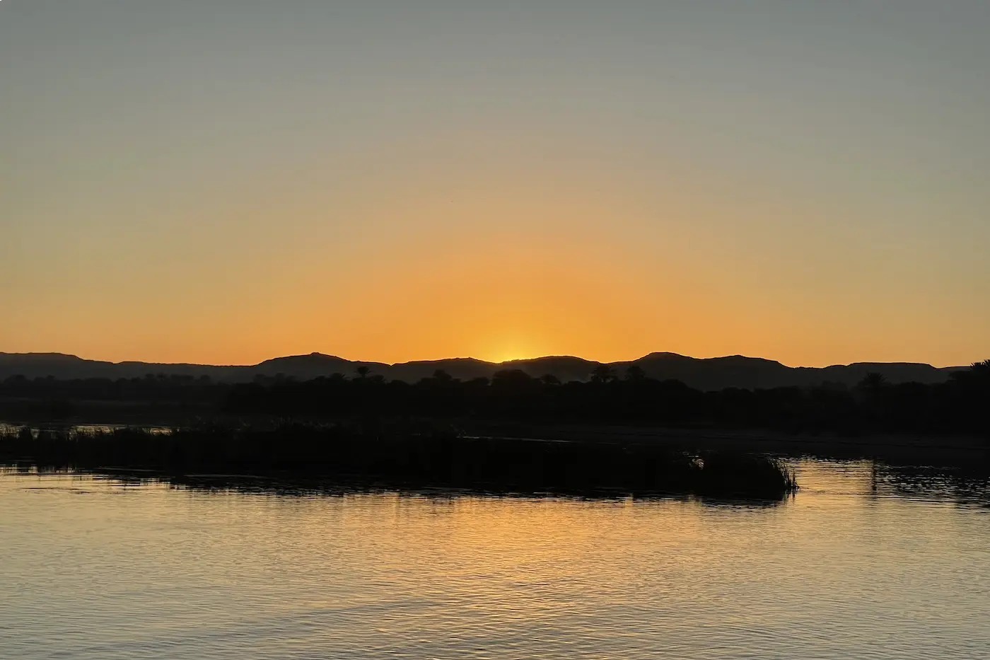 Sunset over the Nile at the end of a private day of tours in Luxor